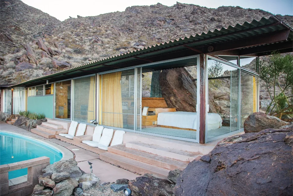 Frey House II fits between granite boulders above a small pool on its Palm Springs hillside.