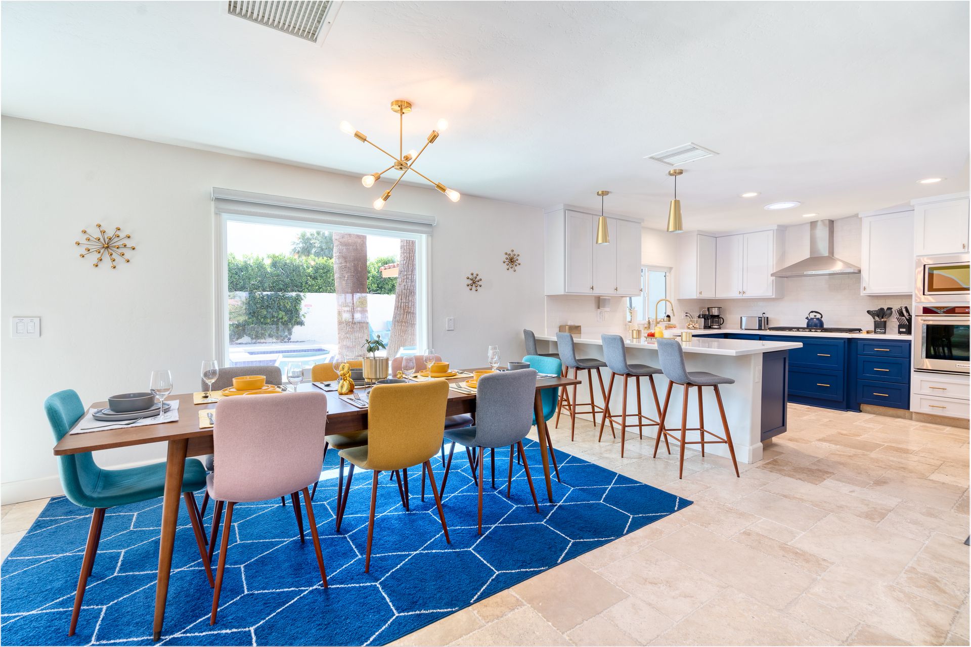Open kitchen and dining area with blue cabinetry