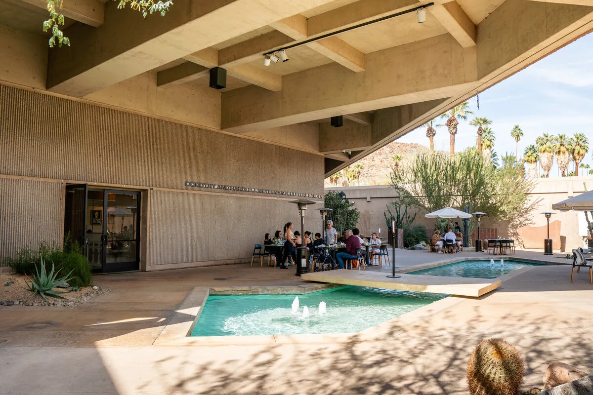 Diners sit beside fountains on the Livs patio in the Palm Springs Art Museum sculpture garden.