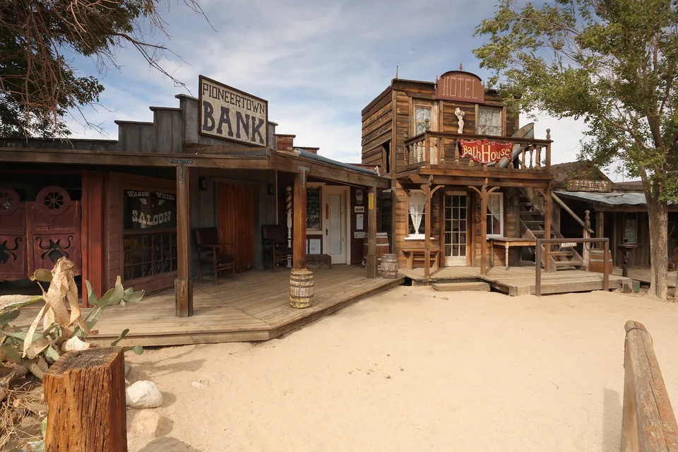 The Pioneertown Bank, Bath House, saloon, and livery facades line the sandy edge of Mane Street.